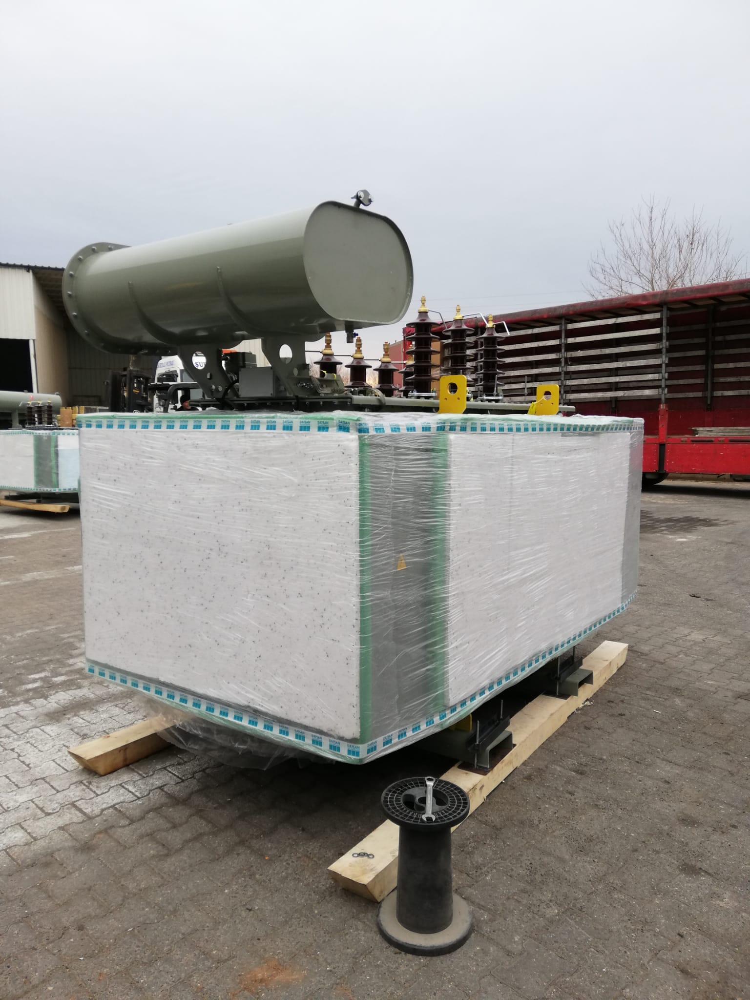 5000 kVA transformer wrapped in protective film before shipment